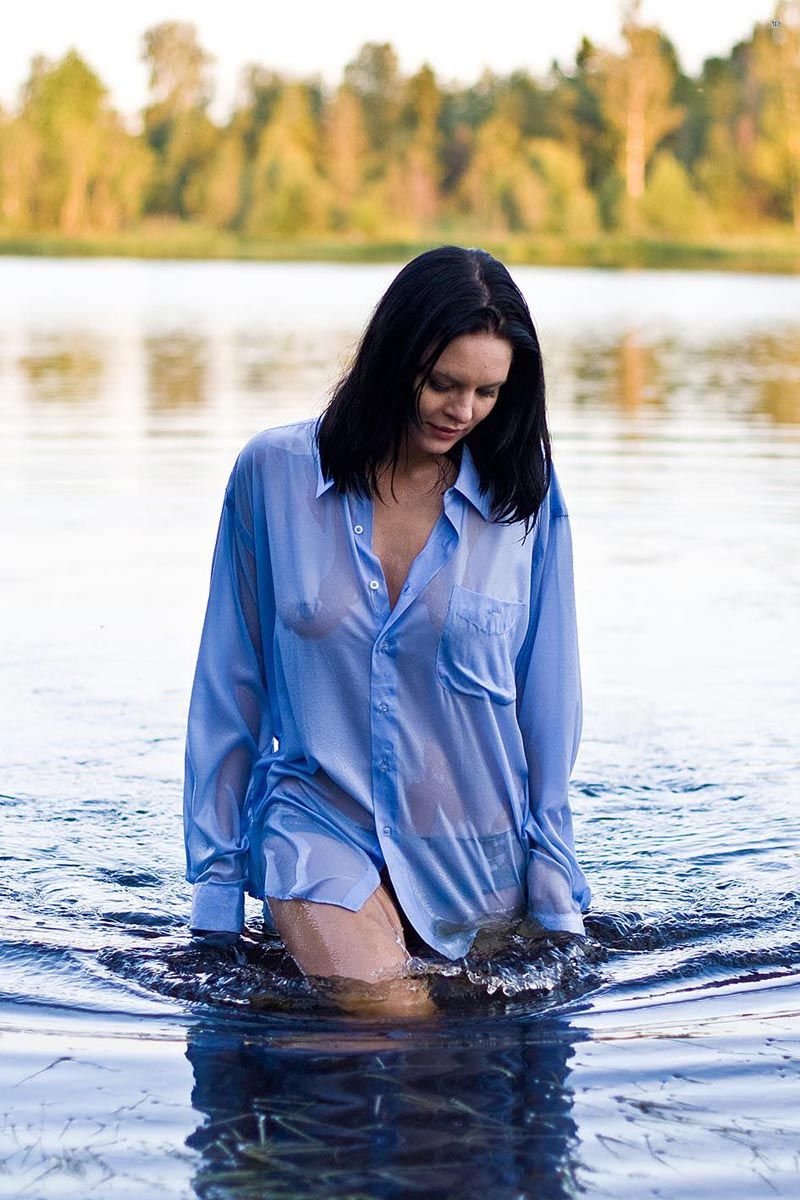 Nude brunette on the lake