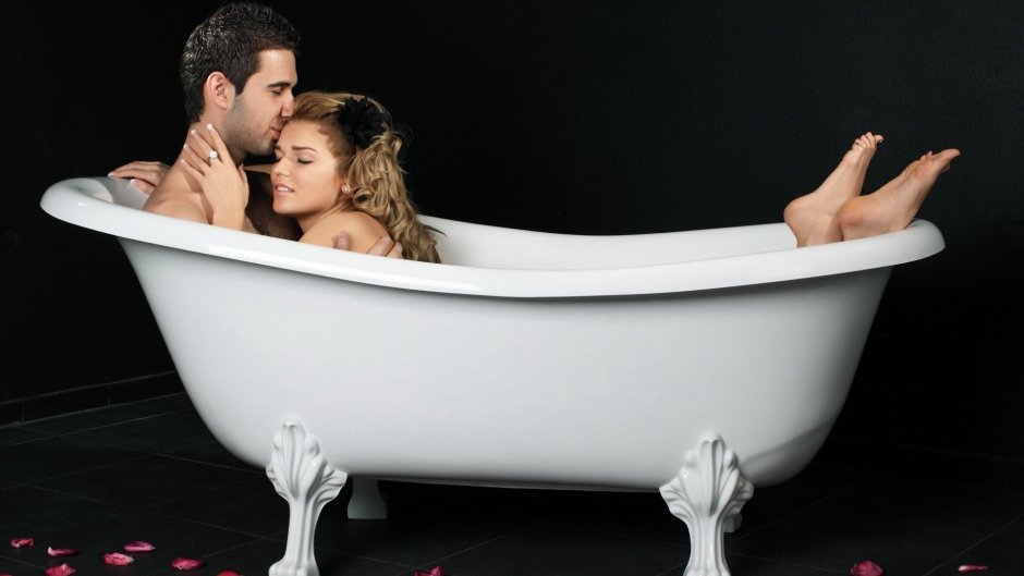 Man and woman bathe together in the bathroom naked