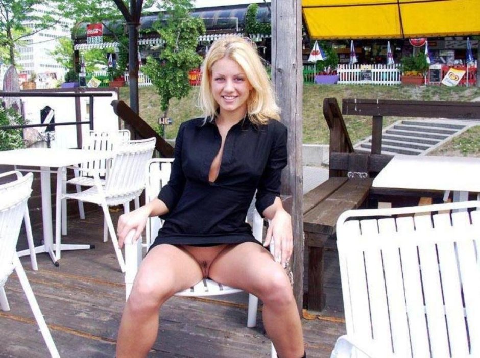 Girl without panties in a cafe on the street