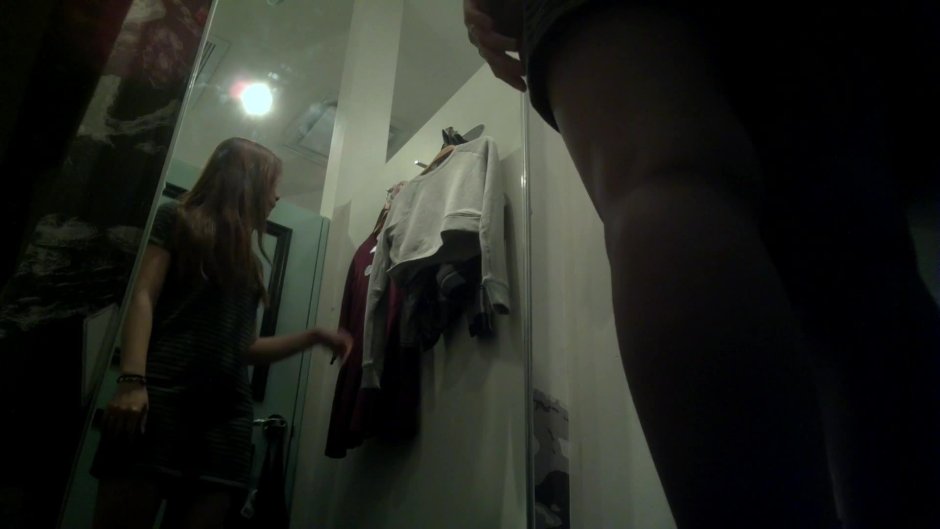 Naked women in fitting rooms