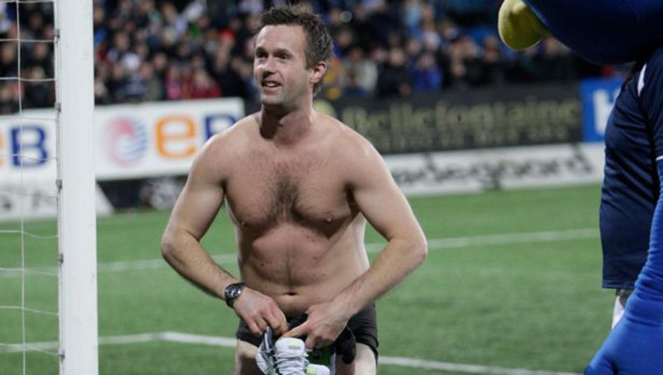 Naked football players on the field