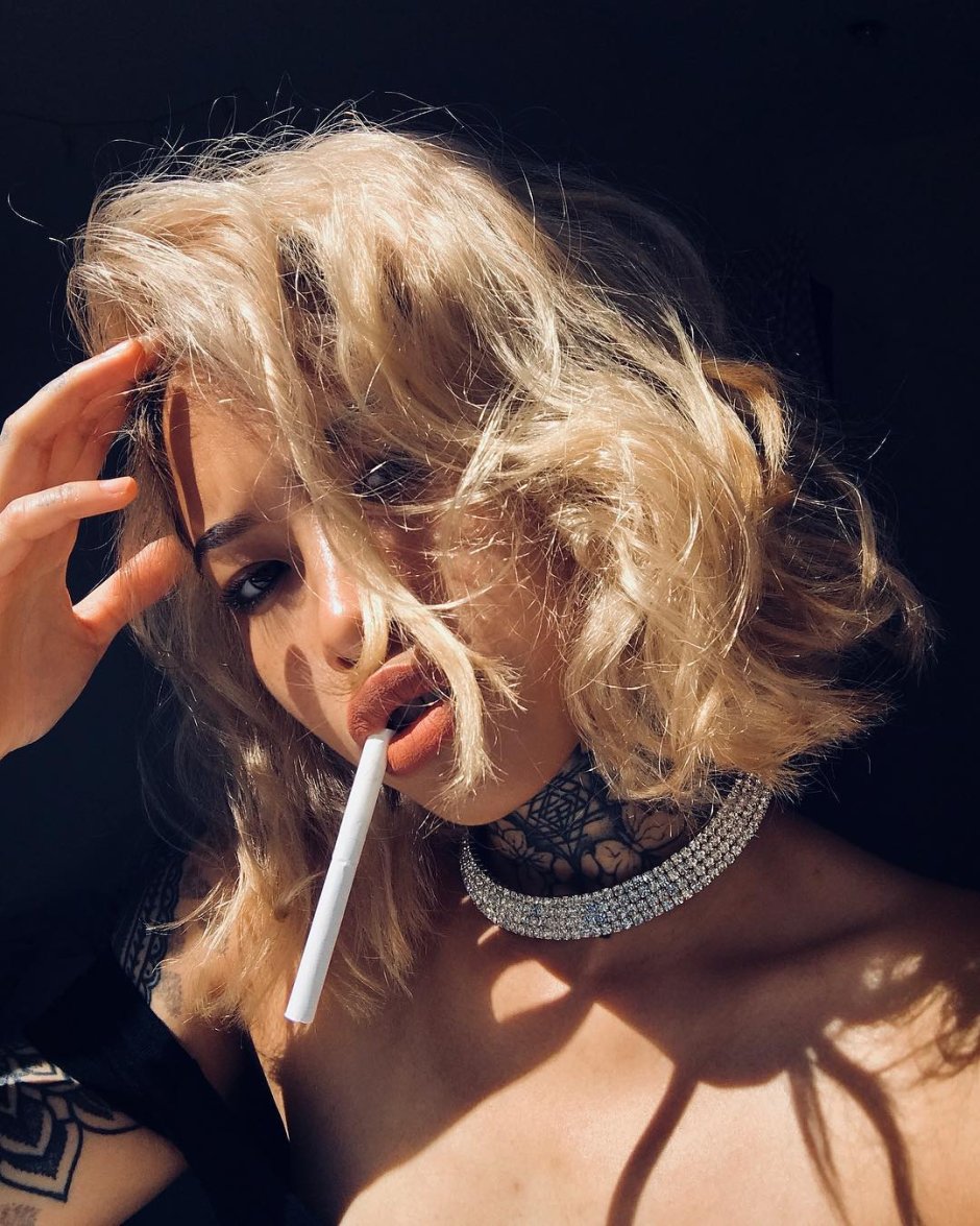 The lady smokes