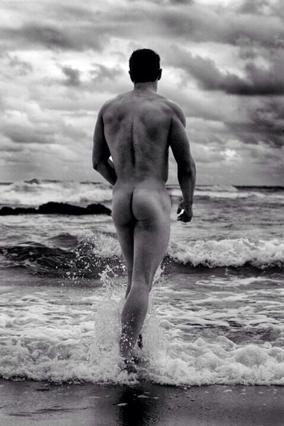 Naked men and women on the beach