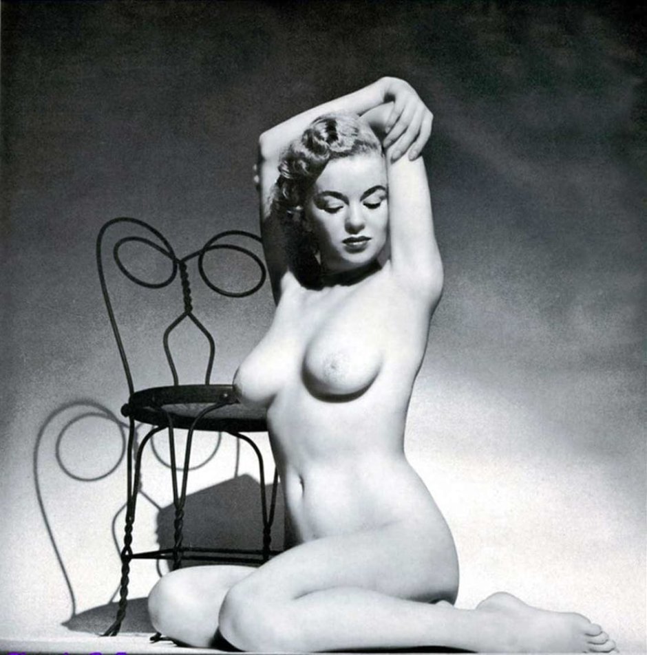 Nude glamor sitting his legs spread