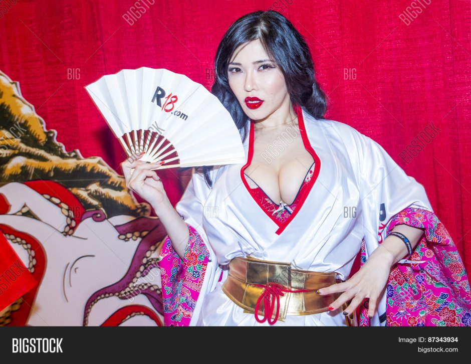Hitomi Tanaka in a leopard dress