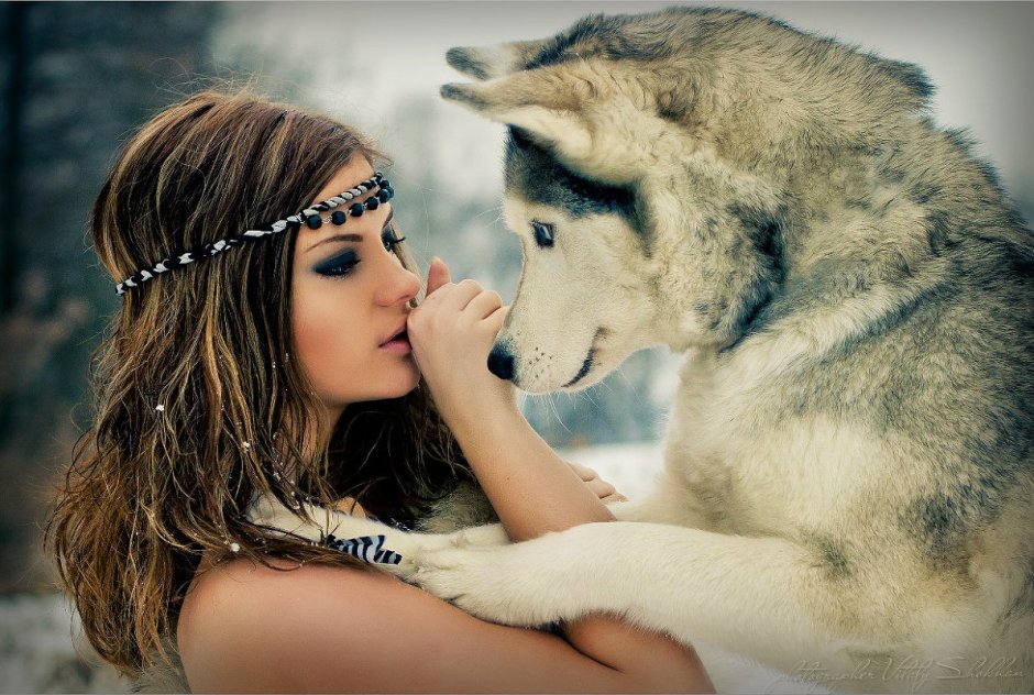 Beautiful girl with a wolf
