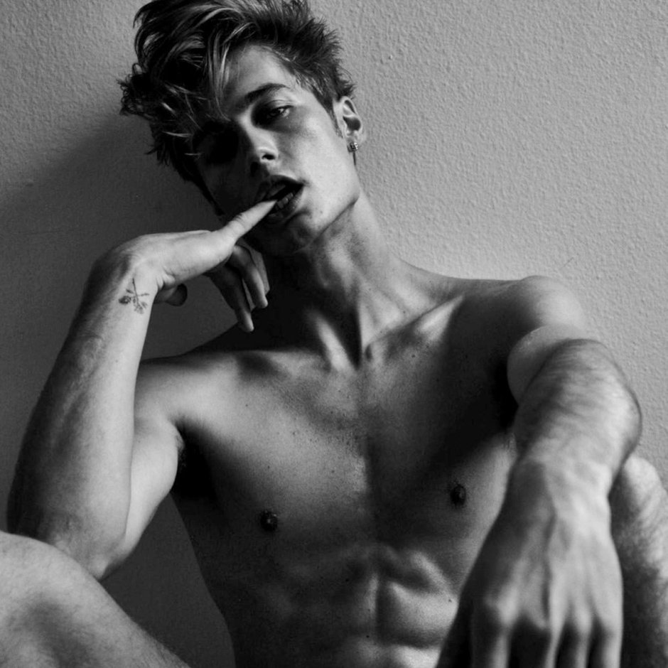 Beautiful young man in shorts