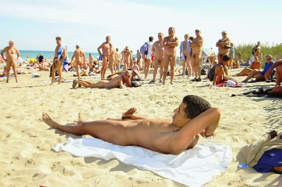 Naked guys on a crowded beach