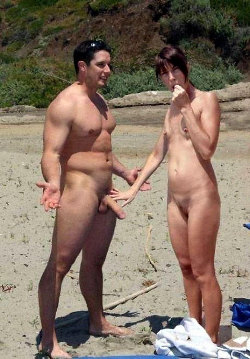Naked men and women on the beach