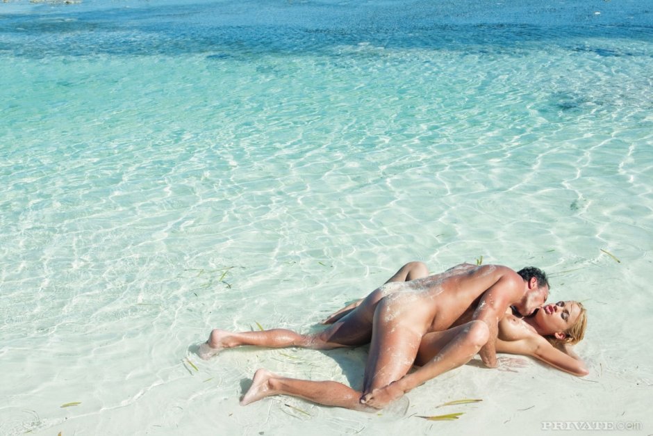 Naked men and women on the beach