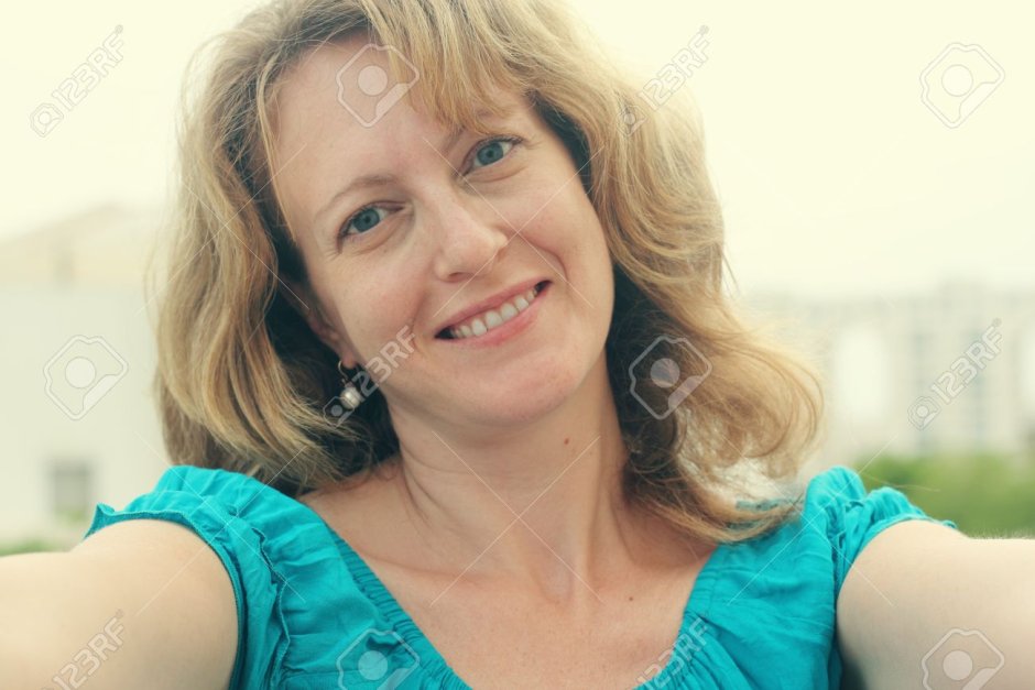 Woman 55 years old portrait of selfie at home