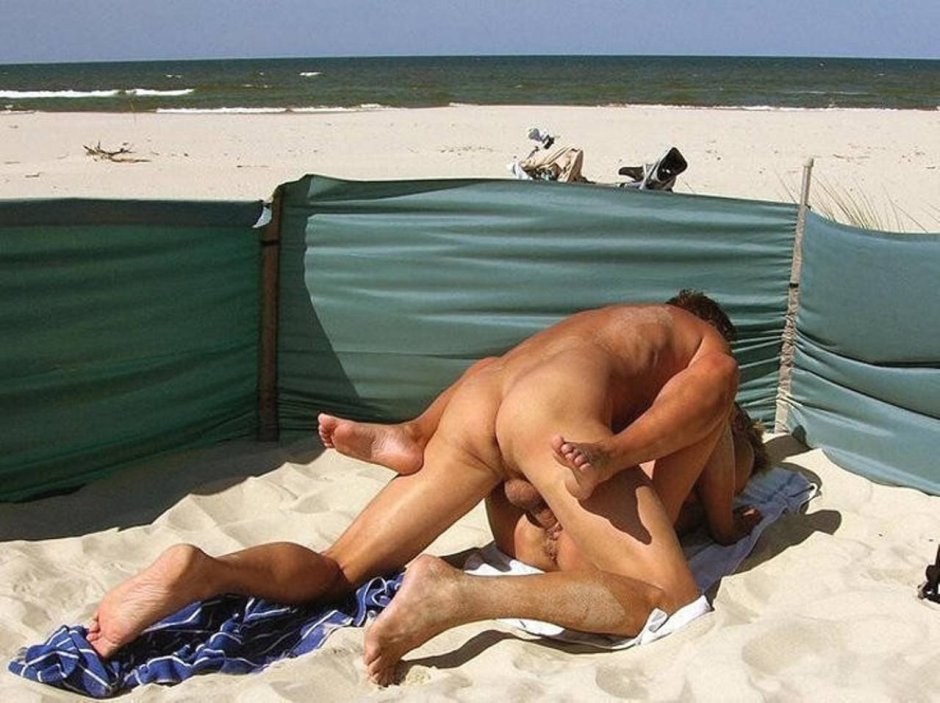 Guys and girls on a nudist beach
