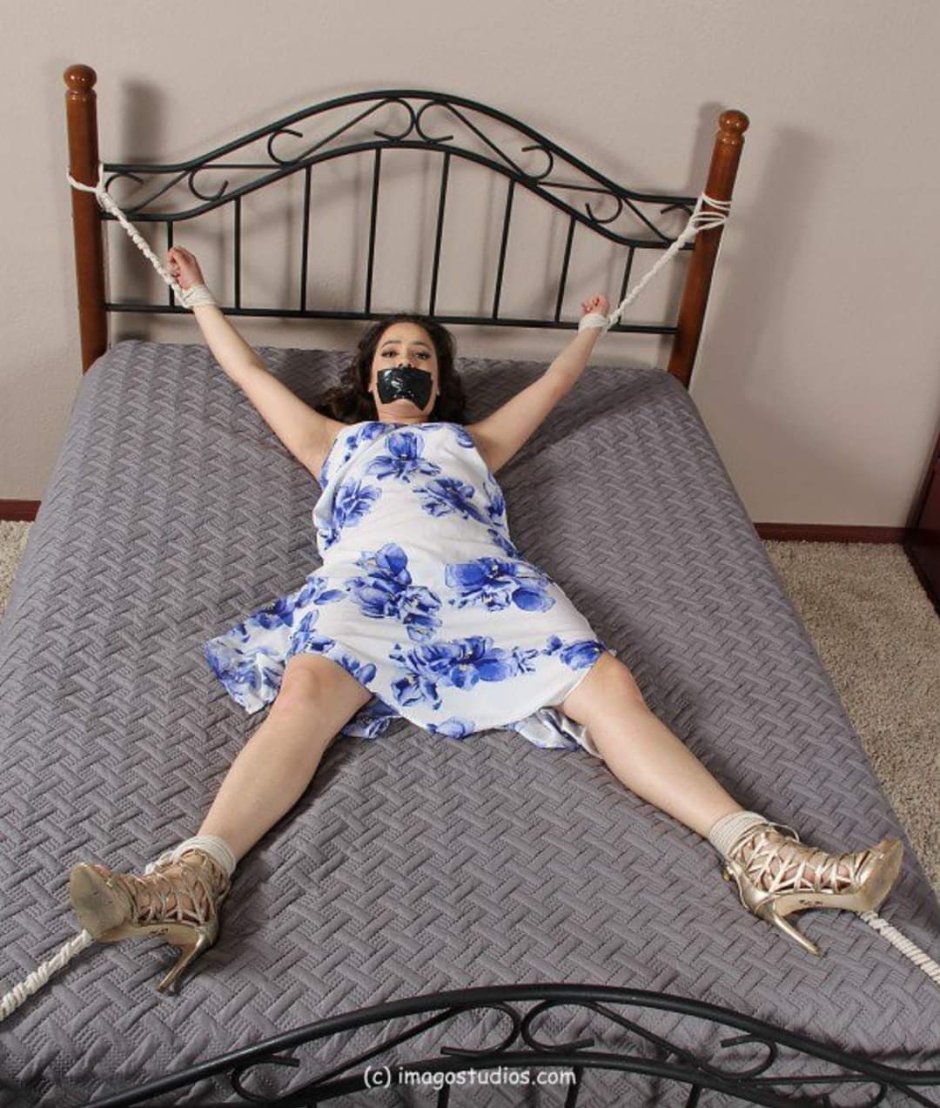The woman is attached to the bed