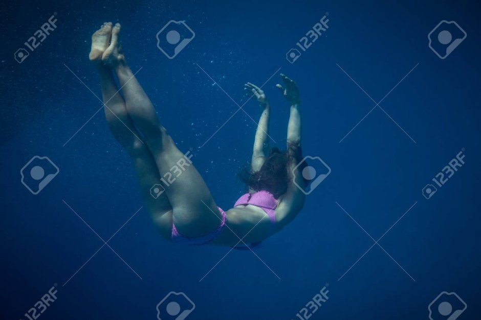 The girl ducked under the water