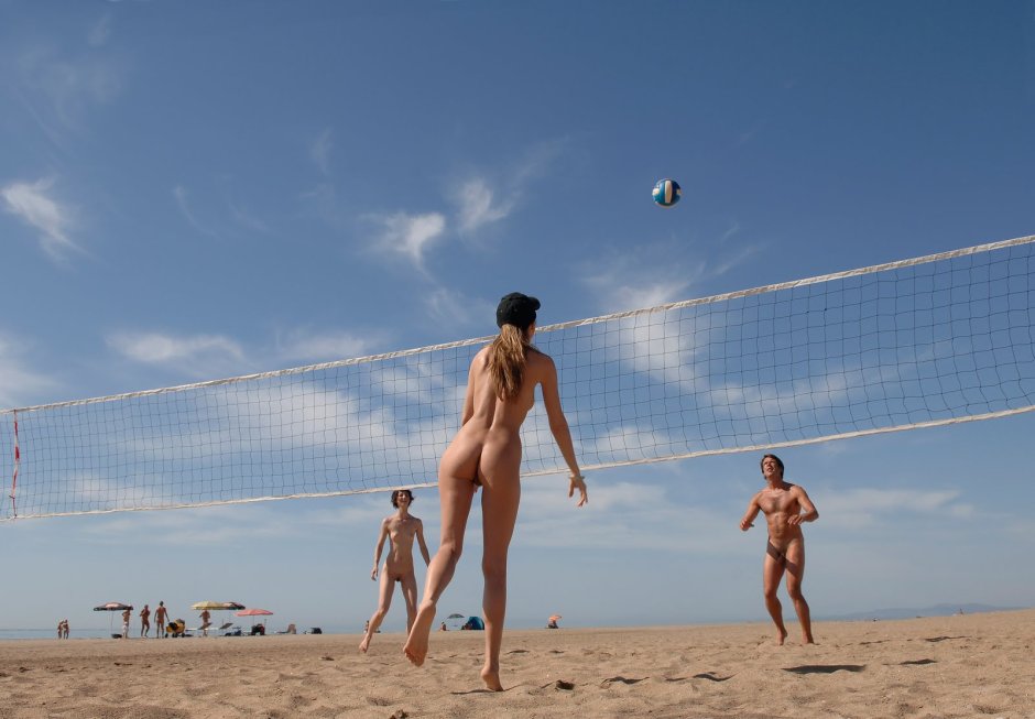 Naked beach volleyball players