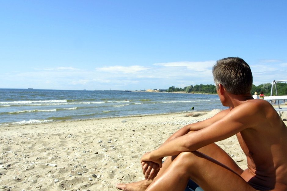 Men on a nudic beach