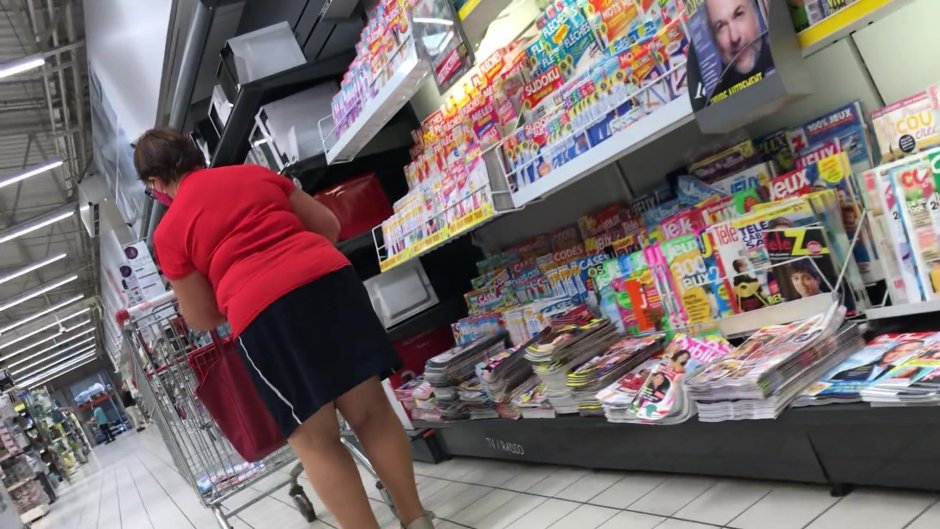 An elderly woman without panties under a skirt