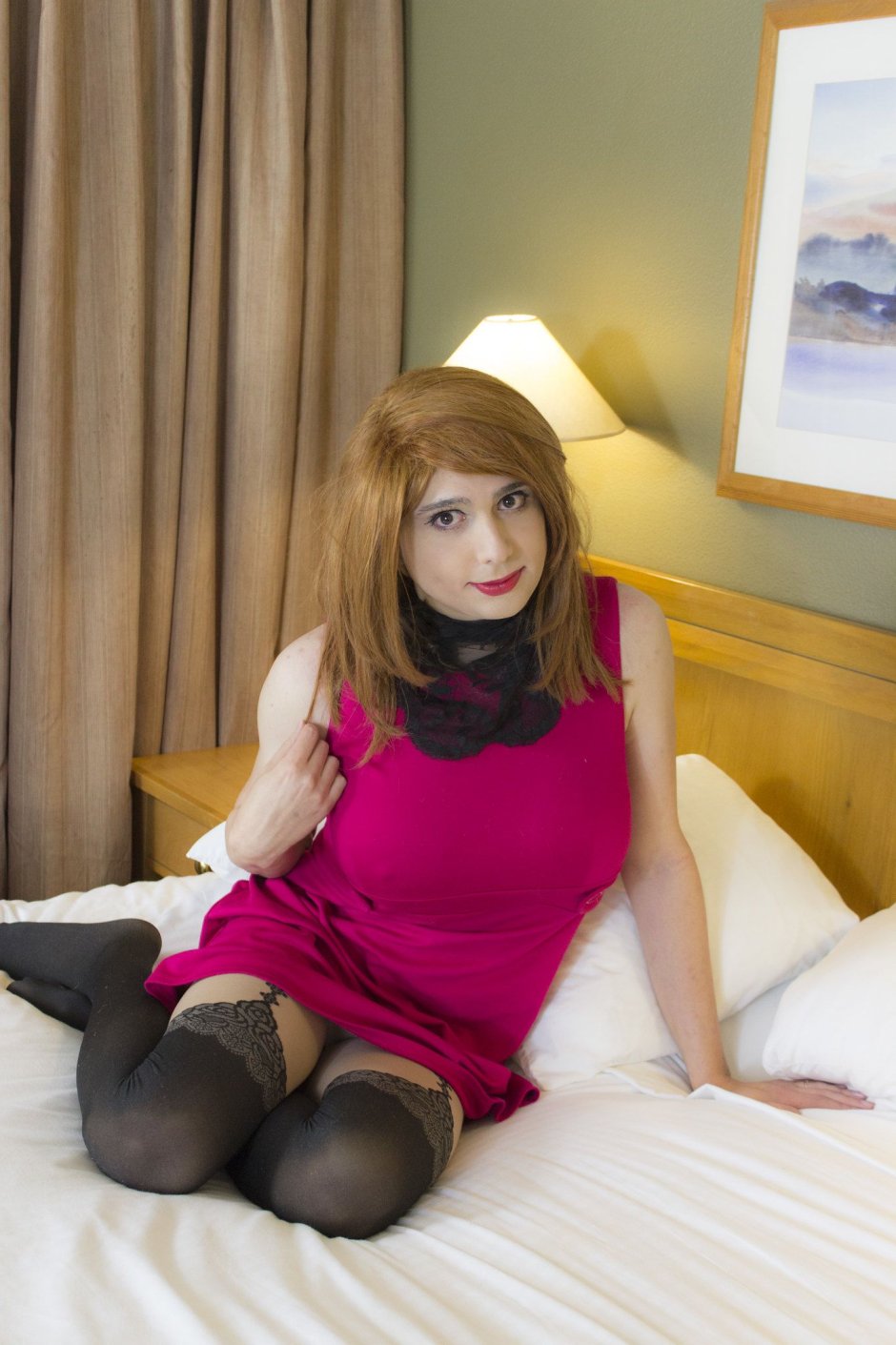 Crossdresser in a dress with a belt