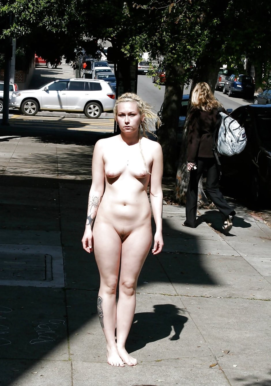 Nudists on the streets of the city naked