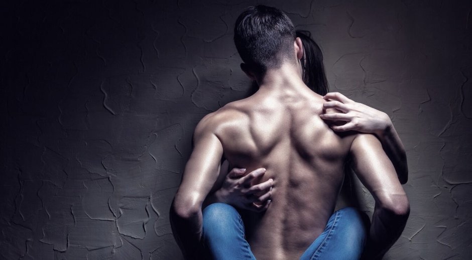 Men's hands on a female back