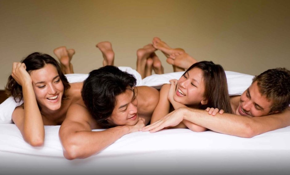 Two couples swing