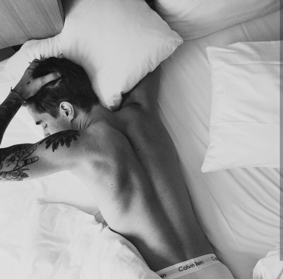 Beautiful men's poses on the bed