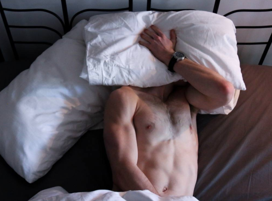 Male body in bed