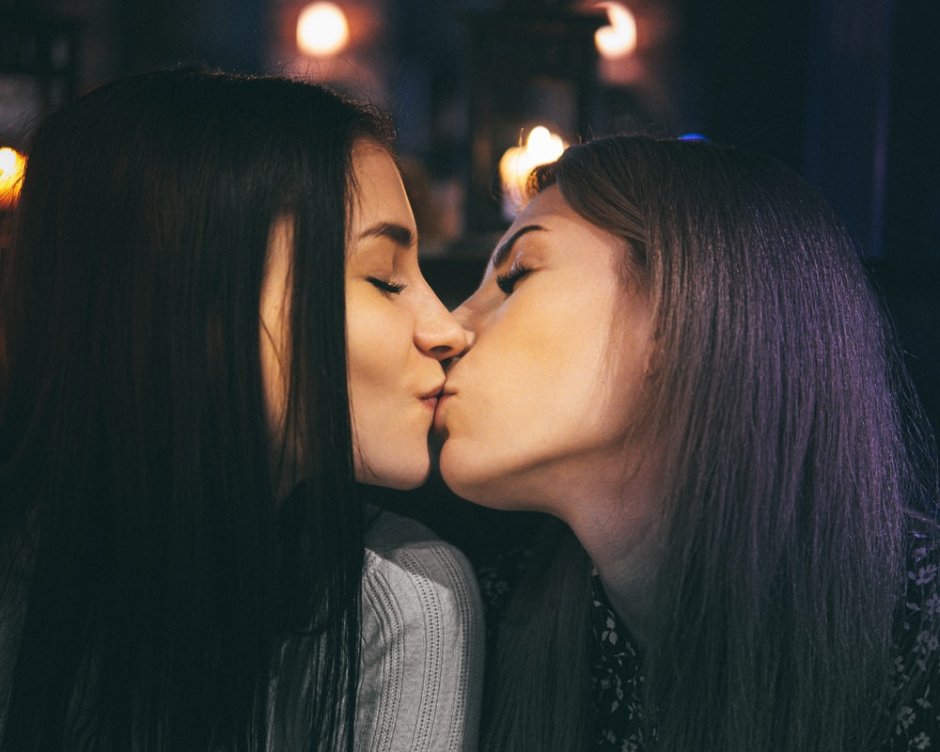 Two girls lick