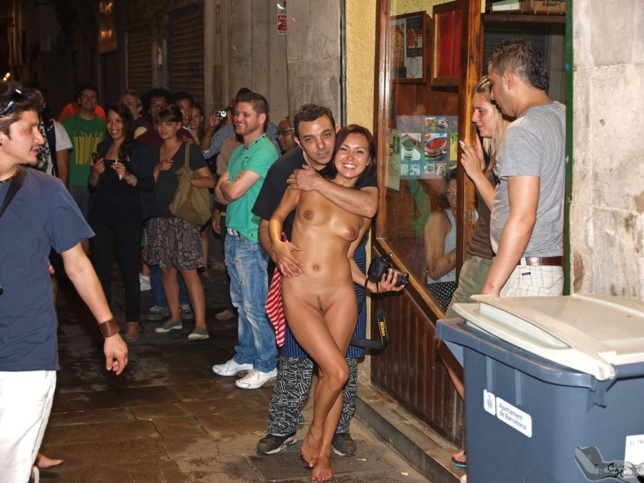 Naked woman among dressed