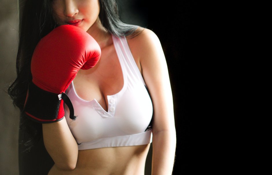 Girls in ancient boxing gloves