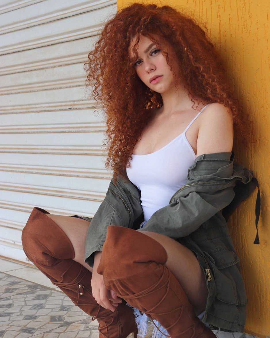 Girl with lush red curly hair