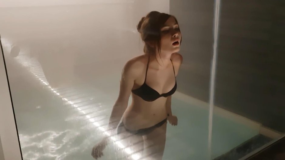 Karina Strimmersha in a swimsuit in a sauna