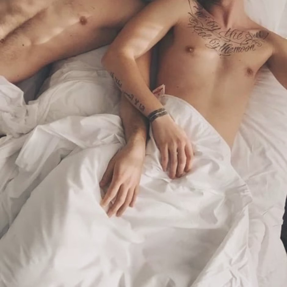 A man in bed with a man