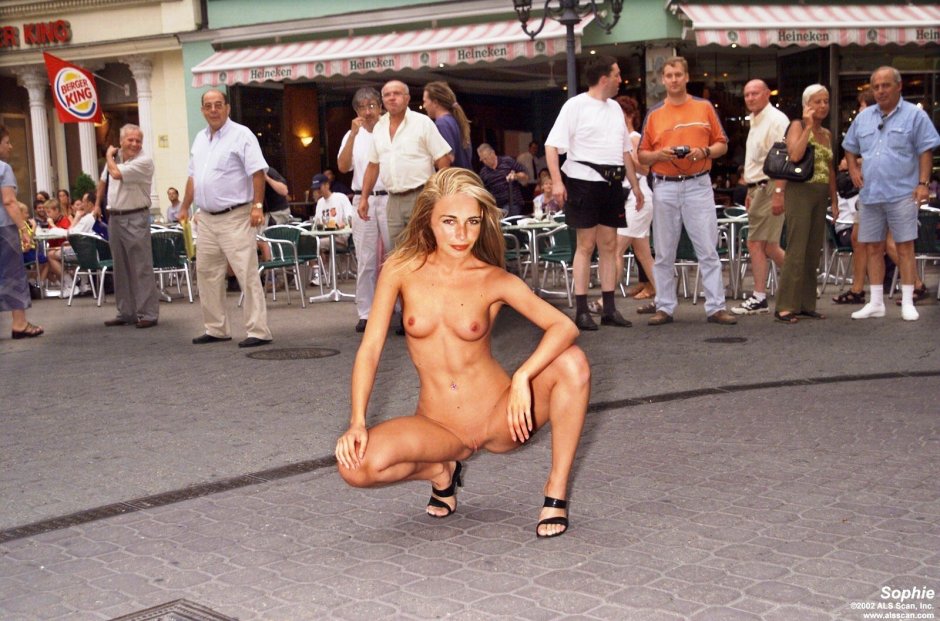 The girl undresses in public