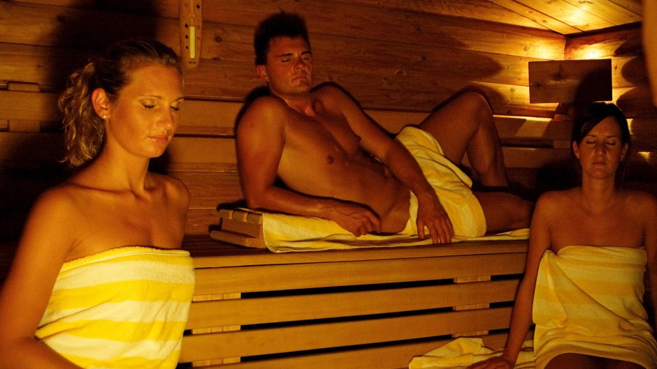Naked girls with guys in a bathhouse