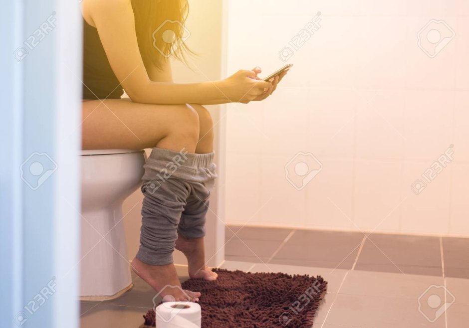 Woman sits in the toilet