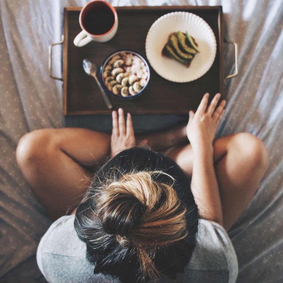 Girl in bed with coffee