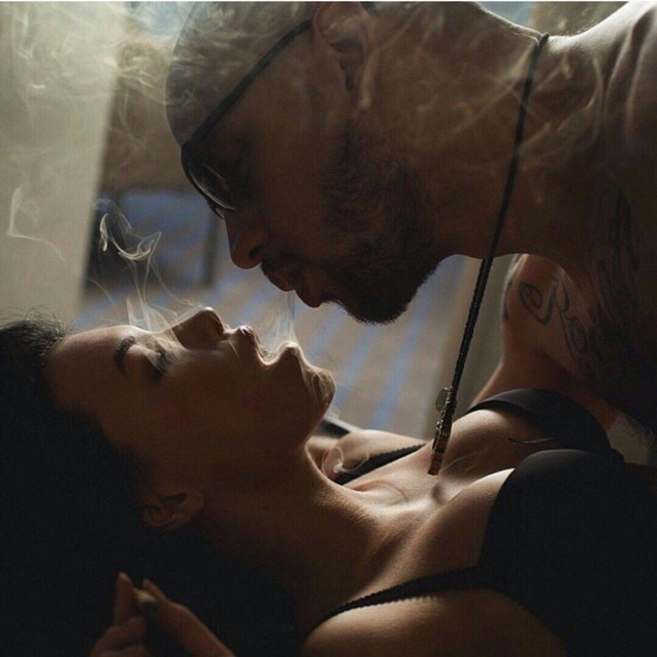 Lovers smoke in bed