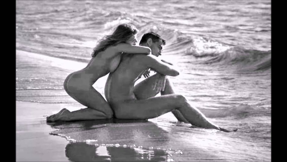 Naked men and women on the beach