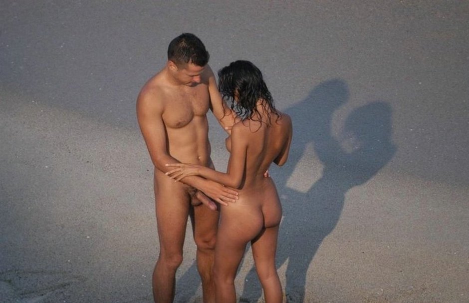 Naked men and women on the beach