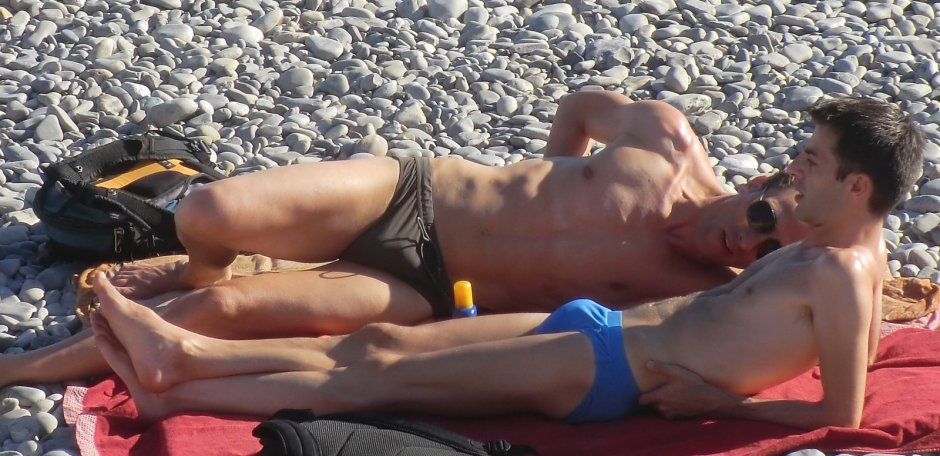 White swimming man on the beach