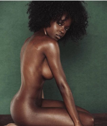 Naked mulatto with an Afro hairstyle
