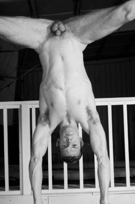 Naked guy on a crossbar