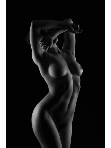 Naked woman on a black background
