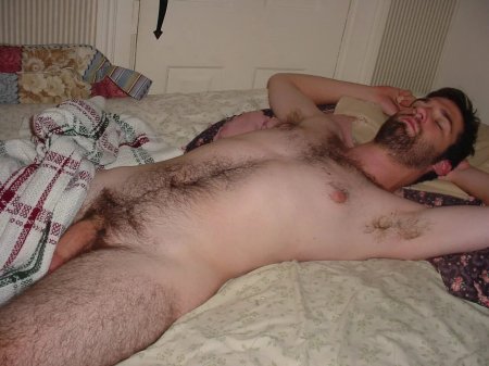Hairy naked man sleeping