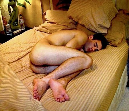 Sleeping naked guy on the bed
