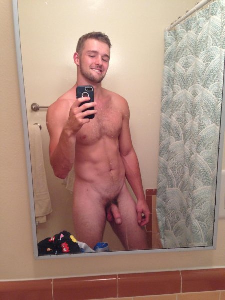 Naked man in front of the mirror