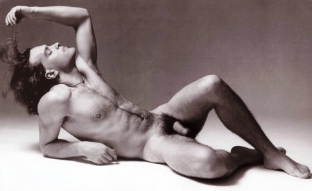 Male poses for a photo shoot in nude style