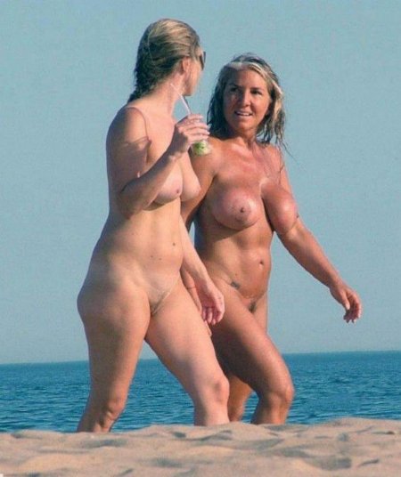Naked women with daughters on beach