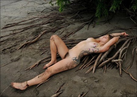 Naked women drowning in mud